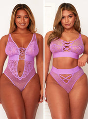 Woman wearing a purple lace lingerie set on a white background