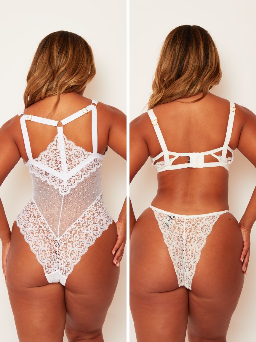 White lace lingerie set worn by a model on a plain background