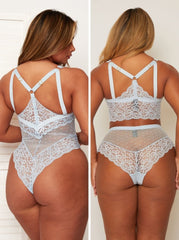 Lace lingerie set worn by a model on a plain background